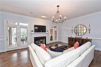 Great Room & Doors Leading to Screened Patio