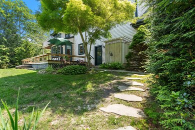 Stone walkway to rear entry of home