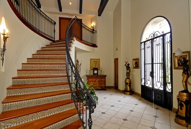 Foyer with formal staircase
