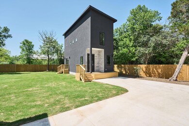 Rear view of house featuring a yard, a patio, a f