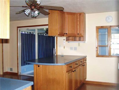 Kitchen. Notice sliding doors leads to pvt sun roo