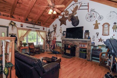 HUGE fireplace with temperature controlled pellet stove under Granite Mantel.
