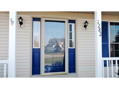 The front entry with new side lights and a cement 