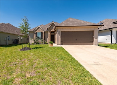 Single story home featuring an attached garage, co