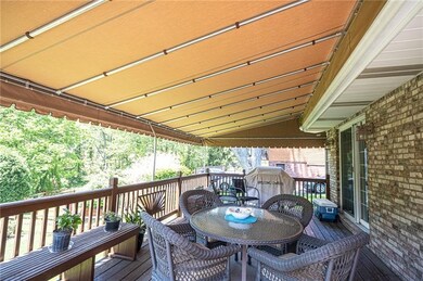 SPACIOUS AWNING COVERED REAR DECK.