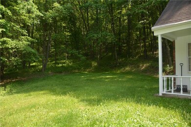 Located on 1.5 acres and surrounded by woods.  Ser