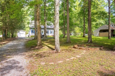 View of front of property featuring an outbuilding