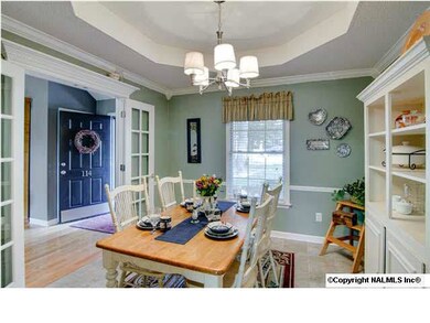 Brand new tile runs throughout the kitchen and dining room. Trey ceiling, chair rail and new brushed nickel light fixture.