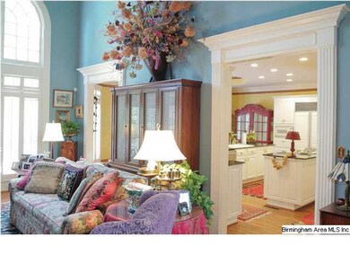 VIEW FROM THE FAMILY ROOM INTO THE KITCHEN AND BRE
