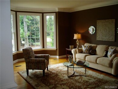 Living Room overlooks front yard through attractiv