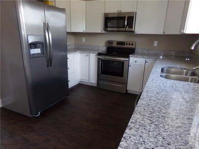Kitchen with granite counters and stainless steel 