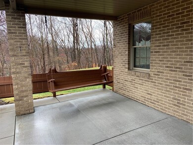Covered front porch with swing to enjoy to summer