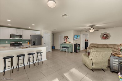 Tiled living room with ceiling fan