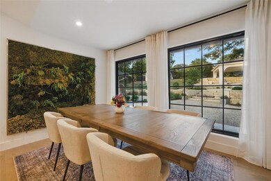 Dining room featuring wood finished floors, reces