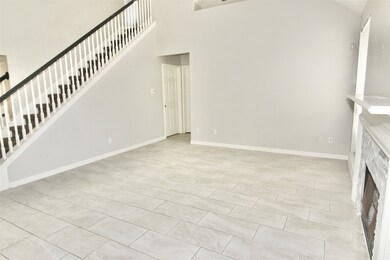 Staircase overlooks the family room