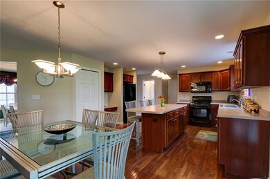 This home has a large eat-in kitchen with hardwood