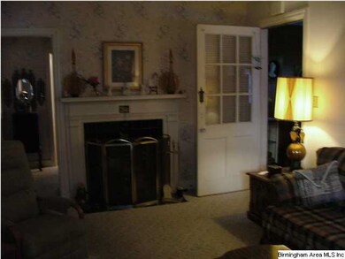 Beautiful family room with black tile woodburning 