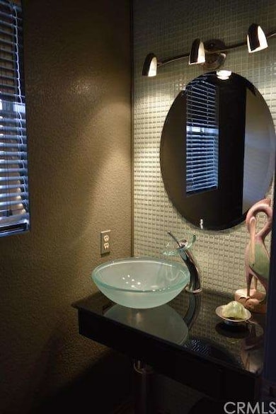 Remodeled modern style downstairs half bath.