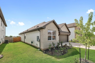 View of home's exterior featuring brick siding, d