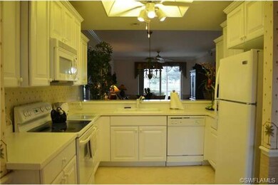 White Kitchen with Corian Counters overlooking Din