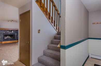 View of Stairs to Upper Level & Living
