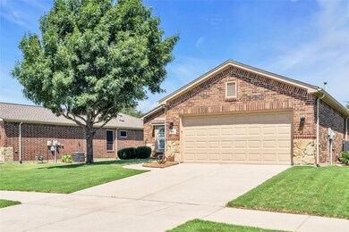 View of property with a garage, a front yard, and 