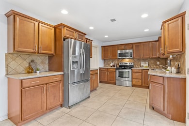 Updated Kitchen with custom cabinets and granite counters. Stainless appliances included.