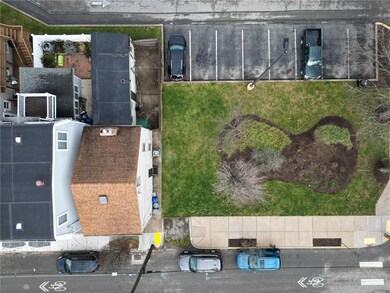 1927 Wharton's lot is 20'x60'. Fenced in patio. Landscaped area to right is cared for and part of ownership of GE parking lot.