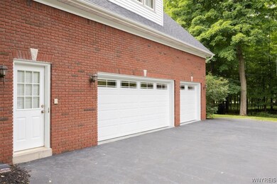 Full 2-story, heated, sideload, 3.5 car garage.