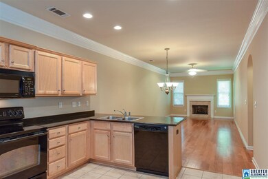 The kitchen is separated from the family room by a