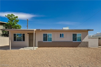 Rear view of house with fence