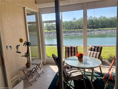 Sunroom / solarium or lakeside lanai-featuring a w