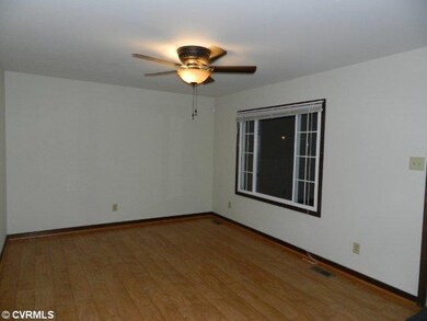 Living Room - New wood flooring and ceiling fan