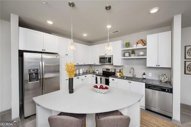 Kitchen with appliances with stainless steel finis