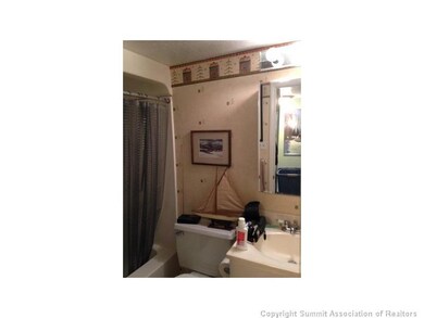 Bathroom. Full bath with vinyl flooring