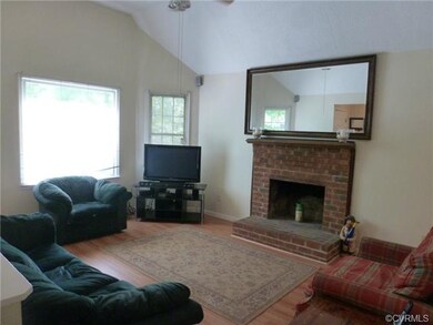 Family Room with Vaulted Ceiling and Ceiling Fan w