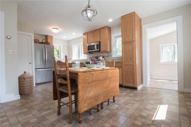 The eat-in kitchen with oak cabinets...