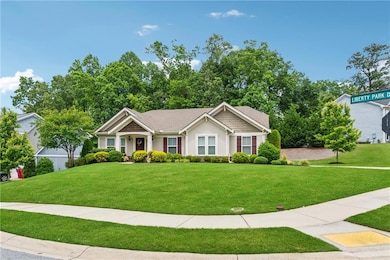 Ranch-style house featuring a front yard and stucc