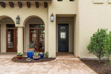 View of exterior entry featuring french doors and