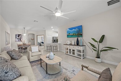 Living area with light tile patterned floors, ceil