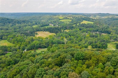 Property nestled in wooded trees.