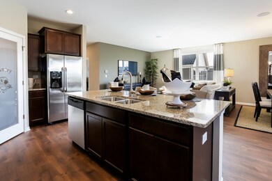 Kitchen's island overlooks spacious great room are