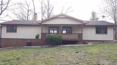 Exterior view of back side of home & deck.