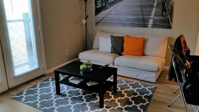 Living room featuring baseboards and wood finishe