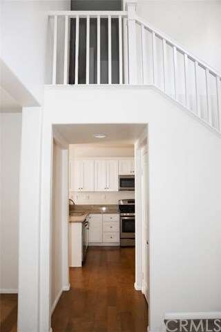 The entry features newer flooring and a deep stora