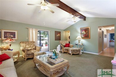 Vaulted Great Room opens to large deck.