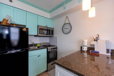 Kitchen featuring stainless steel appliances, blue