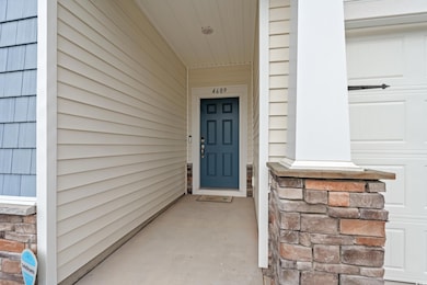 Doorway to property with stone siding