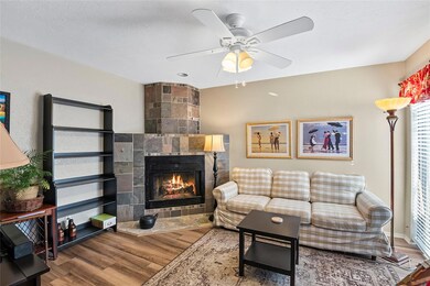 Living room with ceiling fan, hardwood / wood-styl