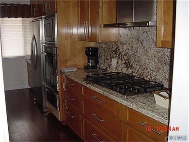 Gas Cooktop with Custom Hood, Granite Counters and